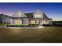 Attractive two-story home with well-kept lawn, professional landscaping, and cozy, inviting curb appeal at 220 Alcovy Reserve Way, Covington, GA 30014