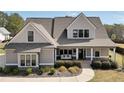 Inviting two-story home with a covered porch and a swing for relaxing at 220 Alcovy Reserve Way, Covington, GA 30014