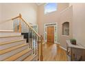 Bright foyer featuring hardwood floors, staircase with wrought iron railings, and ample natural light at 2738 Riderwood Ne Ln, Marietta, GA 30062