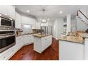 Gourmet kitchen featuring stainless steel appliances, granite countertops, and a center island at 1055 Beacon Hill Xing, Alpharetta, GA 30005