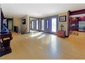 Open concept foyer features a set of double doors and hardwood flooring throughout at 3985 Loch Highland Ne Pass, Roswell, GA 30075