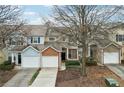 Inviting townhouse exterior featuring colorful facade and attached garages at 577 Reed Se St, Atlanta, GA 30312