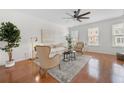 Spacious living room with hardwood floors, fan, and abundant natural light at 3655 Chattahoochee Summit Se Dr # 16, Atlanta, GA 30339