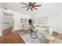 Bright living room with hardwood floors, ceiling fan, and neutral decor at 3655 Chattahoochee Summit Se Dr # 16, Atlanta, GA 30339