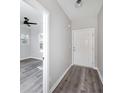 Light and airy foyer featuring gray walls and modern gray hardwood flooring at 944 Woodland Ave, Atlanta, GA 30316
