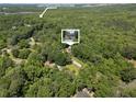 Aerial shot of a home nestled amongst the trees near Sweetwater Creek State Park at 2158 Huckleberry Ln, Lithia Springs, GA 30122