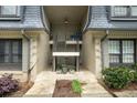 A welcoming building entrance showcases the access to individual units, enhanced by carefully selected greenery at 123 Maison Nw Pl, Atlanta, GA 30327