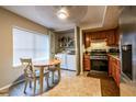 Eat-in kitchen with stainless steel appliances and wood cabinets at 1406 Springleaf Se Cir, Smyrna, GA 30080