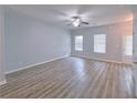 Bright living room featuring neutral paint, ceiling fan, and access to the backyard at 1892 Old Dogwood, Jonesboro, GA 30238
