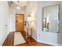 Charming entryway with stylish lighting, hardwood floors, and a decorative table creating a welcoming atmosphere at 878 Peachtree Ne St # 704, Atlanta, GA 30309