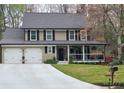 Charming two-story home featuring a spacious two-car garage and a welcoming covered front porch at 2263 Hill Creek Way, Marietta, GA 30062