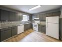 Well-maintained kitchen with granite countertops, ample cabinetry, and modern appliances at 4228 Lakes End Nw Dr, Kennesaw, GA 30144