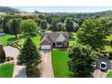 An aerial view of a home nestled amongst the trees in a tranquil and private residential area at 16 Kentucky Ne Walk, Cartersville, GA 30121