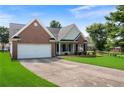 Beautiful single-Gathering home with a well-manicured lawn, a two-car garage and a brick and siding exterior at 16 Kentucky Ne Walk, Cartersville, GA 30121