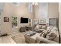 Spacious living room with vaulted ceilings, built-in shelves, and a cozy fireplace at 1355 Pinebreeze Way, Marietta, GA 30062