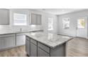 Open concept kitchen featuring granite island and stainless steel appliances at 189 Park Ln, Fairburn, GA 30213
