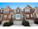 Attractive townhomes with brick exteriors, attached garages, and well-maintained landscaping at 1286 Creekside Se Ter, Smyrna, GA 30082