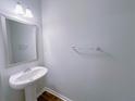 Bathroom with pedestal sink, neutral wall color, and chrome fixtures at 1531 Iris Walk, Jonesboro, GA 30238