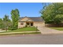 Charming home features a manicured lawn and a two-car garage at 3792 Refinement Way, Douglasville, GA 30135