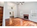 Bright and spacious living room boasts hardwood floors, high ceilings, fireplace, and abundant natural light at 4400 Old Allgood Cir, Stone Mountain, GA 30083