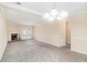 Spacious living room featuring a fireplace, neutral walls, and a ceiling fan with lighting at 5509 Park S Pl, Atlanta, GA 30349