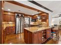 Spacious kitchen features a large island with granite countertops and stainless steel appliances at 1206 Red Fox Cir, Woodstock, GA 30188