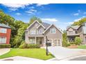 Charming two-story craftsman home with stone accents, a well-kept lawn, and an inviting front porch at 931 Hidden Falls Se Ln, Smyrna, GA 30082