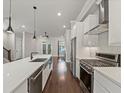 Modern kitchen with stainless steel appliances and sleek quartz countertops at 1110 Bakary Ct, Decatur, GA 30032