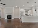 Bright living space with a cozy fireplace and an open-concept layout into the modern kitchen at 1110 Bakary Ct, Decatur, GA 30032