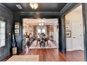 Elegant dining room with hardwood floors and stylish decor, perfect for entertaining at 3621 Portland Trail Dr, Suwanee, GA 30024