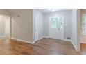Inviting foyer featuring stylish flooring and a beautiful front door that fills the space with natural light at 260 Pleasant Grove Cir, Mcdonough, GA 30252