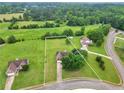 Areal view of lot showing surrounding homes and green space with mature trees at 502 Gallantry Trl, Mcdonough, GA 30252