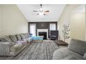 Spacious living room with a fireplace, plush seating, and stylish decor for comfortable relaxation and entertainment at 502 Gallantry Trl, Mcdonough, GA 30252