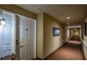 Well-lit hallway with neutral tones provides a welcoming entrance to individual units at 1800 Clairmont Lk # 413, Decatur, GA 30033