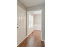 Inviting entryway with hardwood floors and neutral paint, leading to dining area at 3037 Botany Dr, Jonesboro, GA 30236