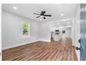 Bright living room with hardwood floors, recessed lighting, and an open view to the kitchen at 2209 Browns Mill Se Rd, Atlanta, GA 30315