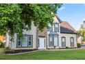 Beautiful two-story home featuring stone accents and professional landscaping, creating an inviting curb appeal at 4186 Stillwater Pt, Ellenwood, GA 30294