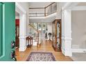 Elegant foyer showcasing hardwood floors, a staircase, and high ceilings that create a grand and welcoming entrance at 1564 Stepstone Way, Lawrenceville, GA 30043