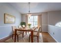Dining room featuring a wood table with seating for four and a decorative chandelier at 3617 Summit Trce, Decatur, GA 30034