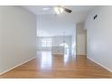 Open-concept living area with hardwood floors, a ceiling fan, and plenty of natural light at 3617 Summit Trce, Decatur, GA 30034