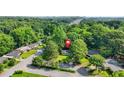 Scenic aerial view of a home nestled among lush green trees, offering privacy and a tranquil setting at 390 Lincoln Sw Pl, Atlanta, GA 30315