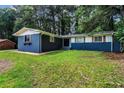 Beautifully landscaped yard and unique window details highlight this home's curb appeal at 4756 Fellsridge Dr, Stone Mountain, GA 30083