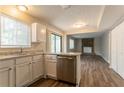 Modern kitchen with stainless steel appliances, granite countertops and luxury vinyl plank flooring at 5092 Stone Trce, Stone Mountain, GA 30083