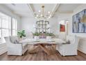 Elegant dining room featuring coffered ceilings, hardwood floors, and stylish decor at 5310 Chestnut Dr, Cumming, GA 30040