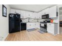 A kitchen featuring white cabinets and stainless steel appliances for a modern feel at 245 Amanda Ct, Stockbridge, GA 30281