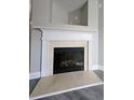 Close-up of the fireplace with a beautiful mantel and hearth at 2612 Haligan Pt, Riverdale, GA 30296