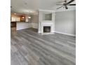 Spacious living room featuring a fireplace, open floor plan, and stylish flooring at 2612 Haligan Pt, Riverdale, GA 30296