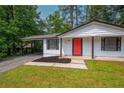 Close-up of the house showcasing its welcoming red front door and cozy front porch at 4922 Glenside Ct, Stone Mountain, GA 30088