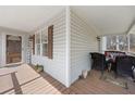 Cozy front porch with rocking chairs, seasonal decor, and 'Welcome' sign at 76 Riverbend Trl, Douglasville, GA 30134