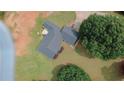 Property features a sprawling lot with a deck at 940 Sandy Ford Rd, Social Circle, GA 30025